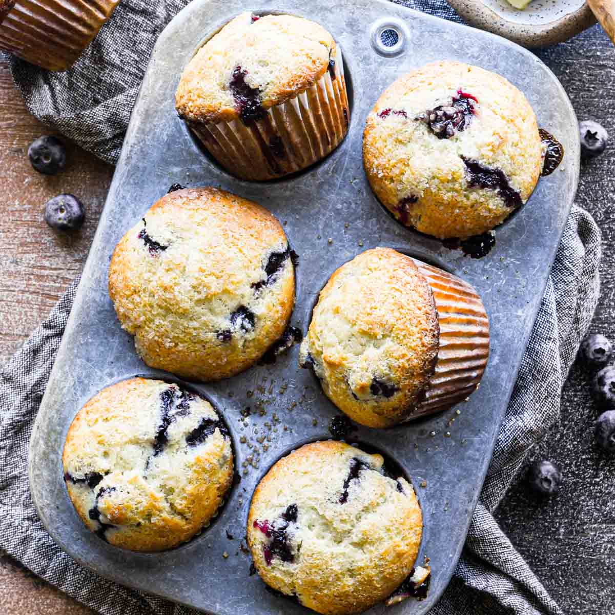 Fresh baked muffins in a muffin tin.
