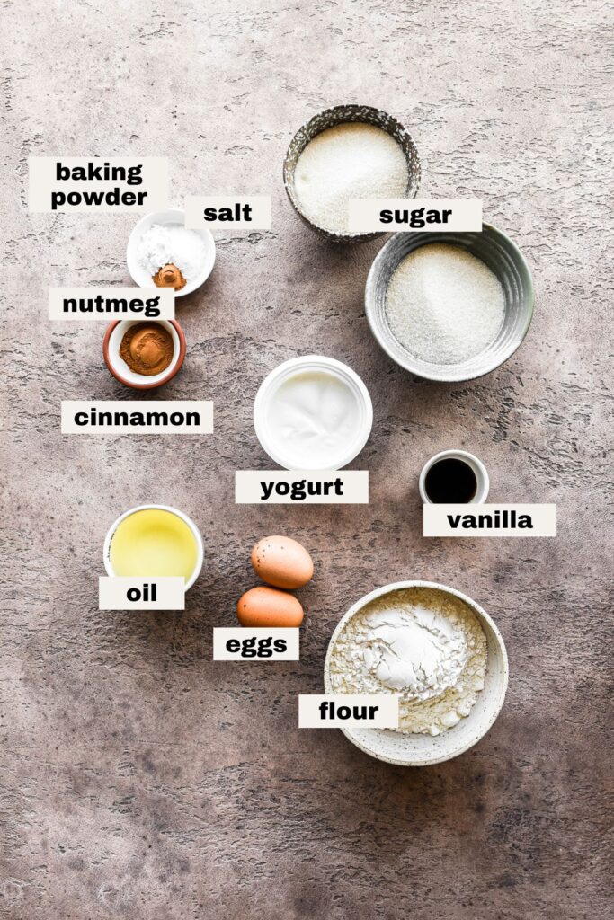 Labeled ingredients on a table for cinnamon swirl cake.