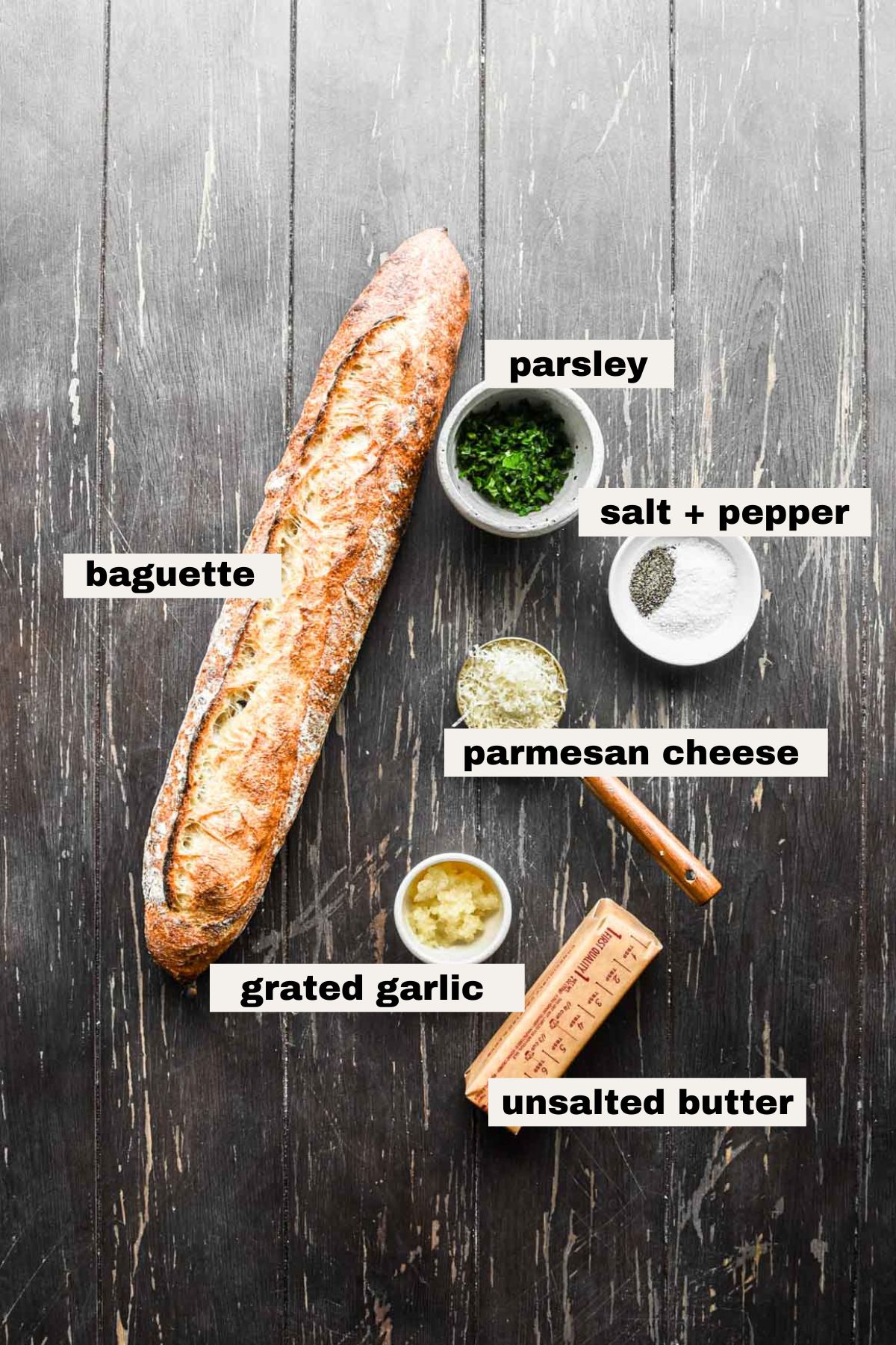 Ingredients on a table for baguette garlic bread.