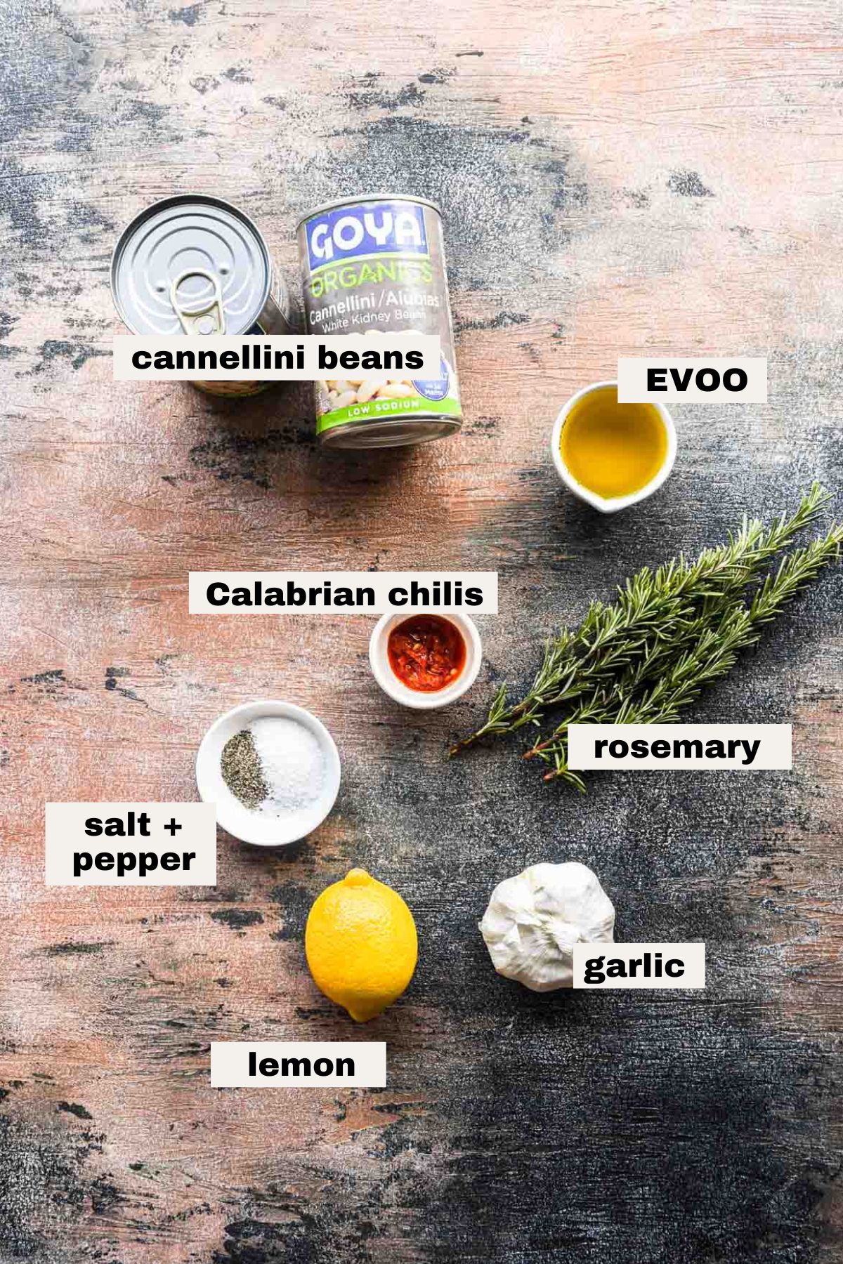 Ingredients needed to make cannellini bean dip on a table.