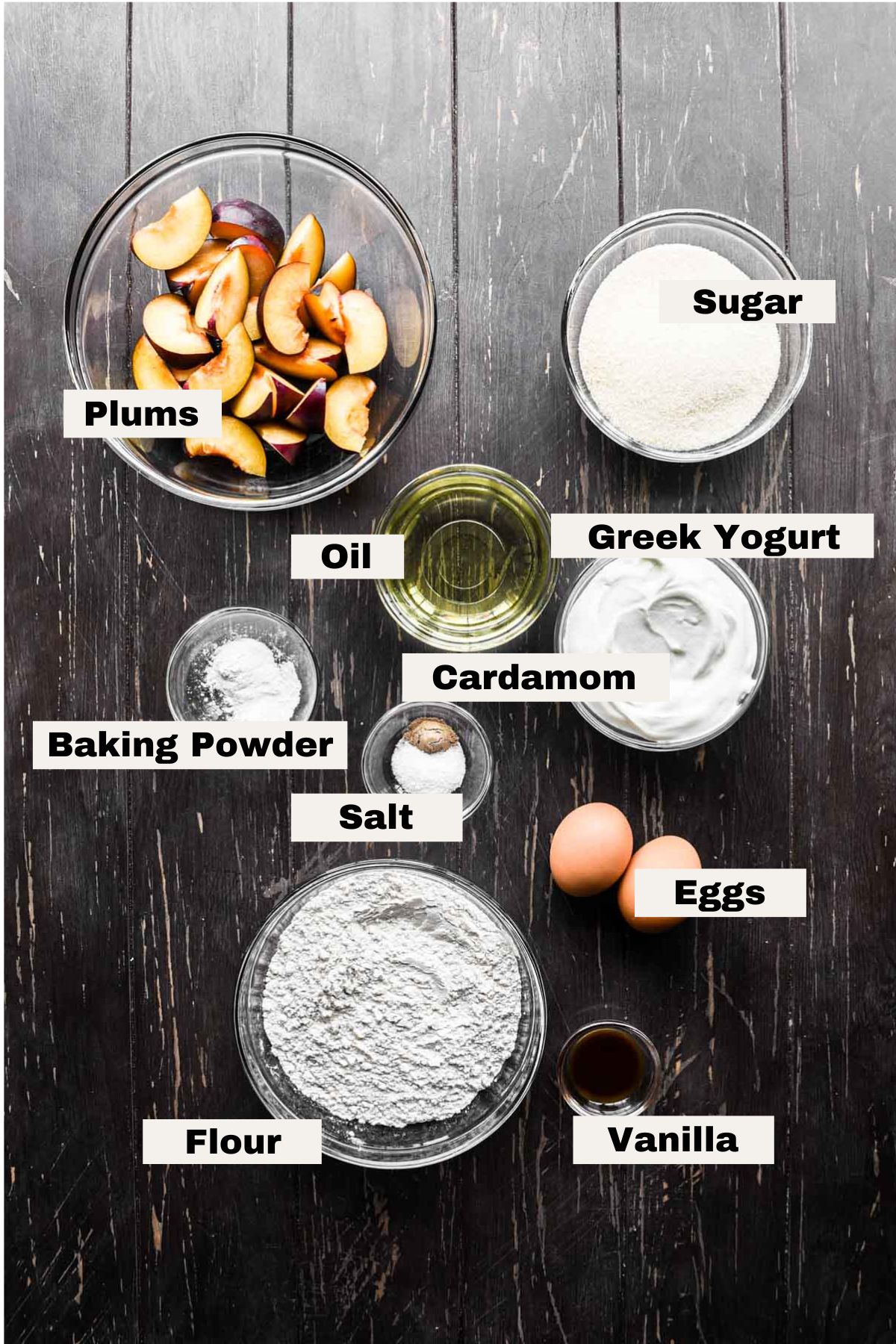 Ingredients on a table to make yogurt plum cake.