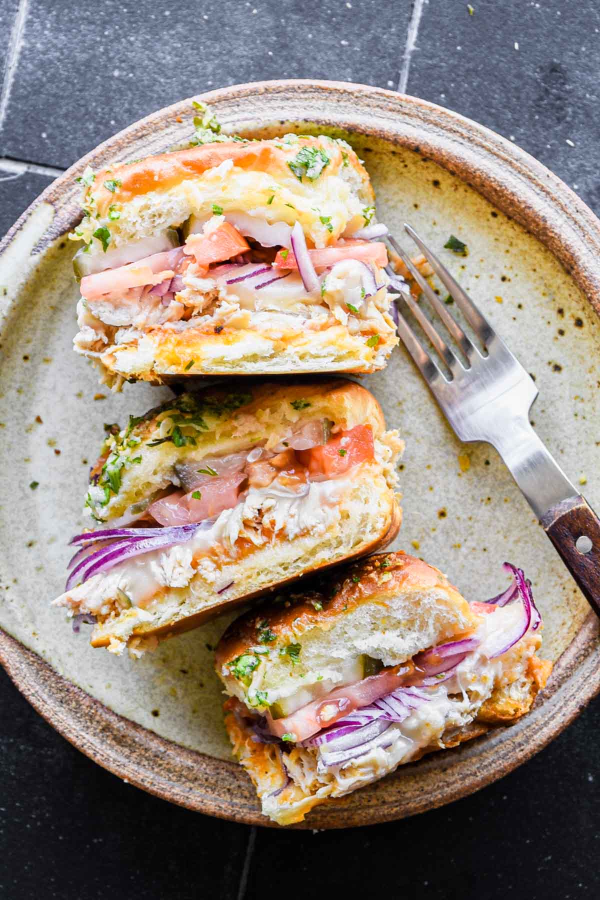 Rotisserie chicken sliders on a plate.