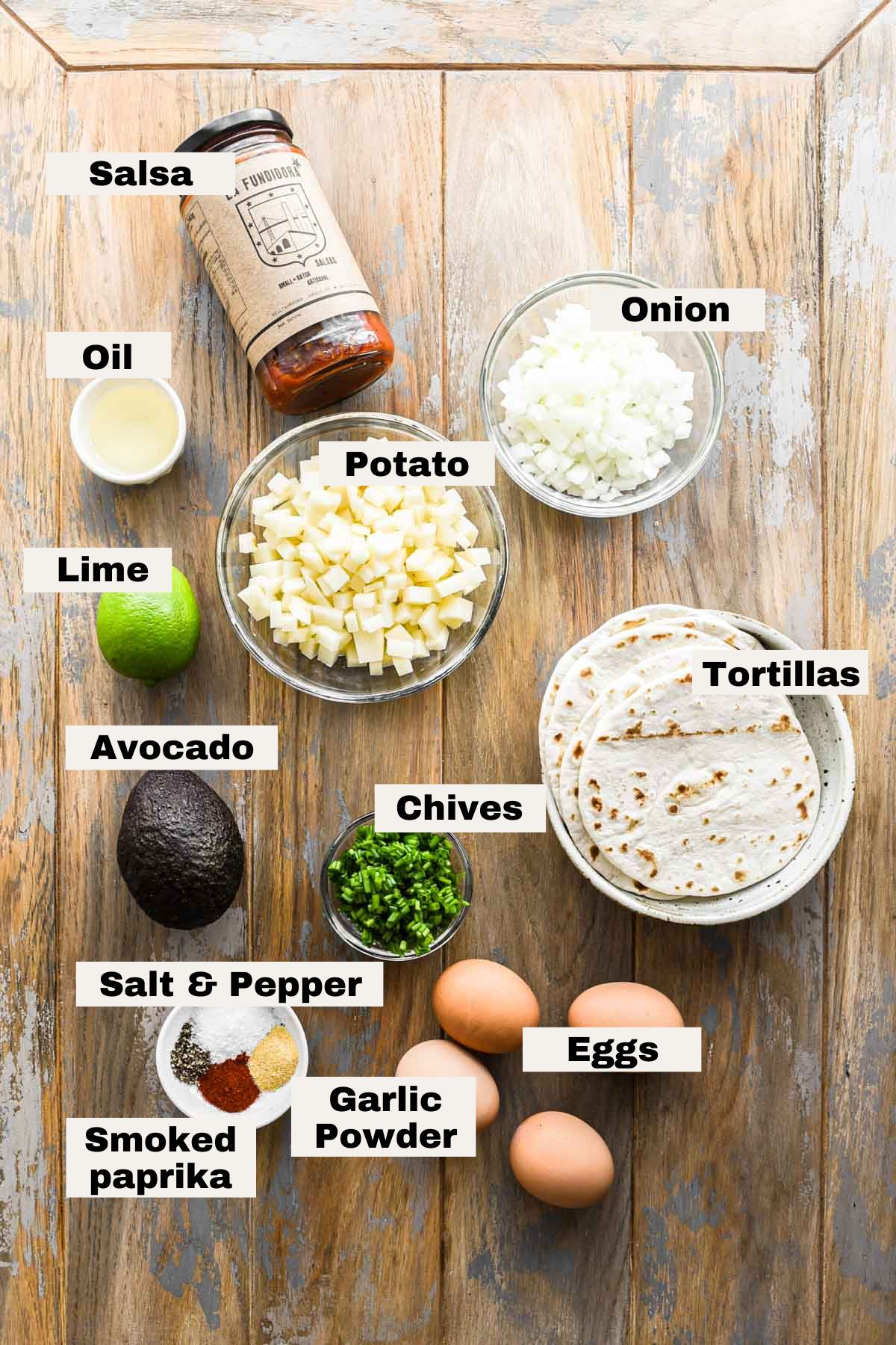 Ingredients for scrambled egg tacos laid out on a table.