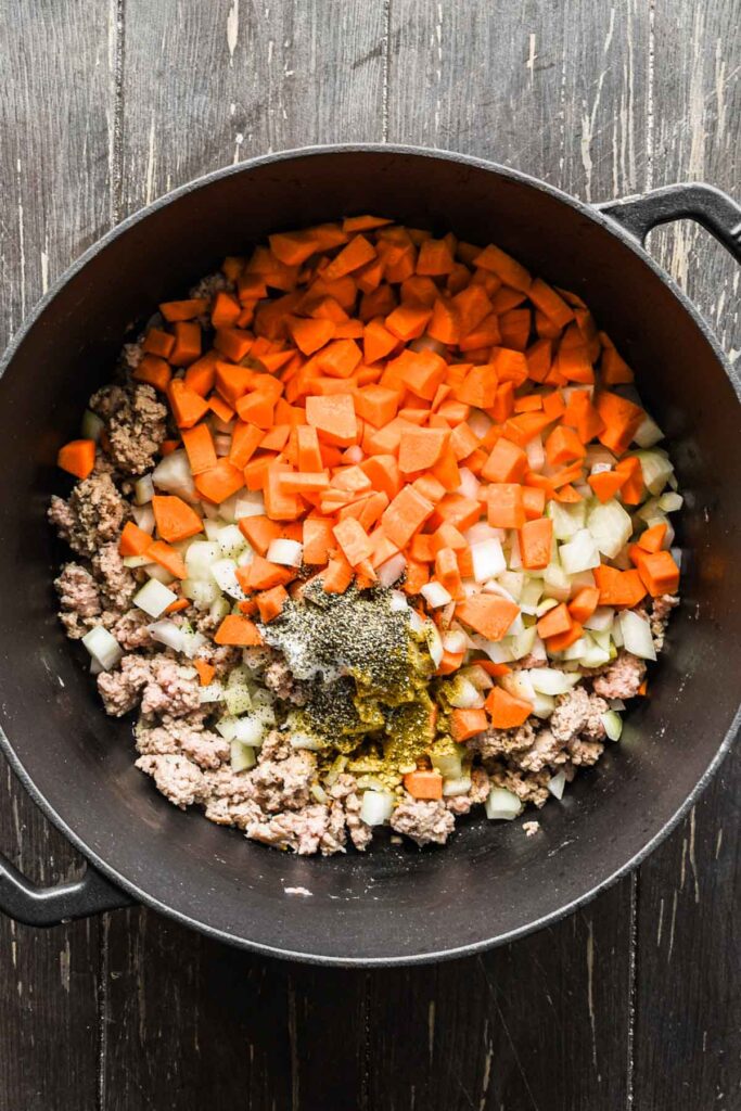 Mirepoix and spices in a pot.