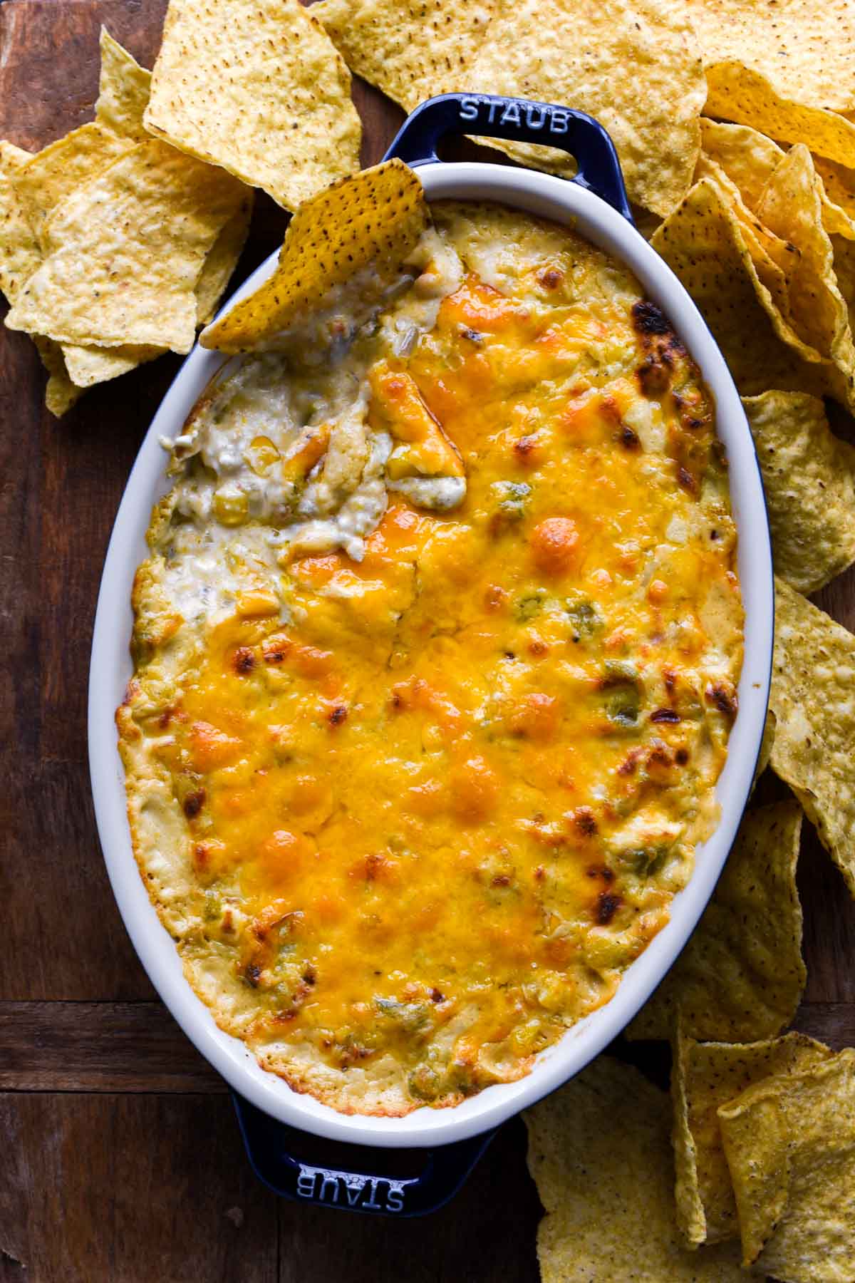 Creamed corn dip with a chip.