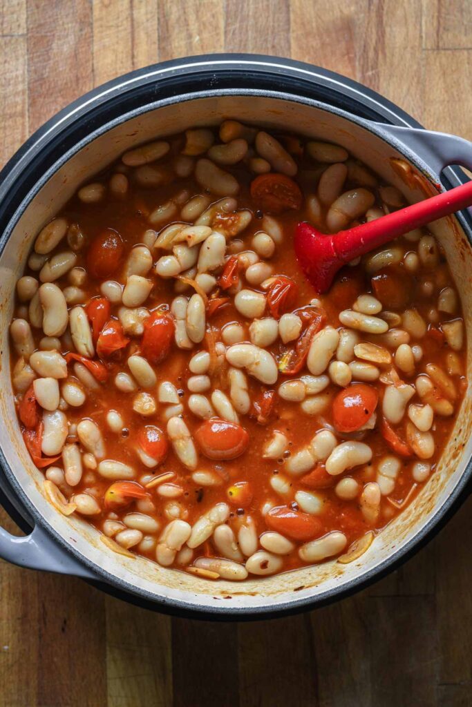 Add the beans to the tomato mixture.