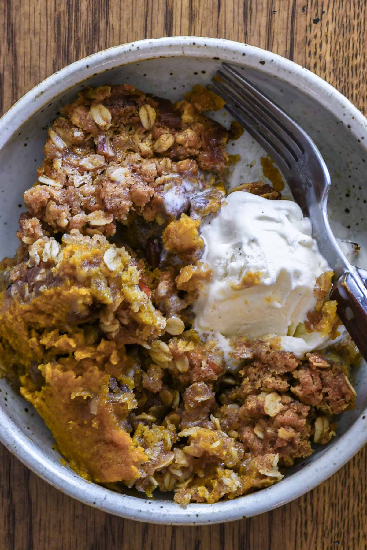 Close up of pumpkin crisp in a bowl.